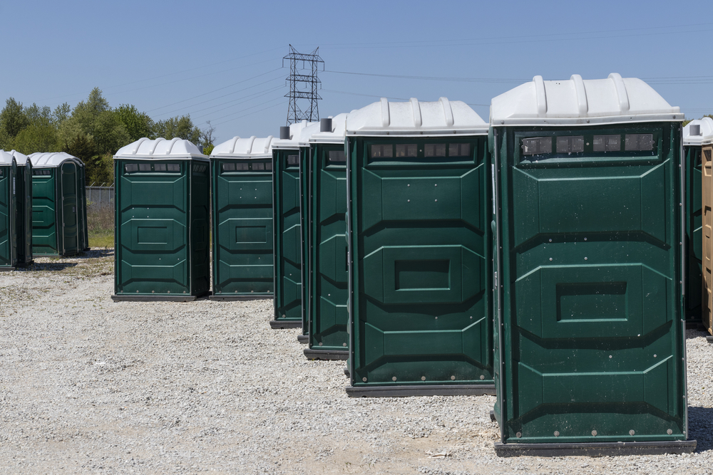 standard portable toilets lined up in Hawaii